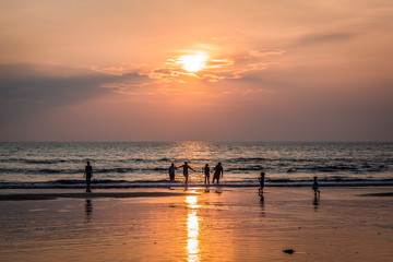 Silhouettes of people on Arambol beach