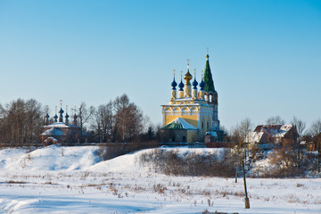 The Church of the Nativity of the Blessed Virgin Mary with a bell tower and the Church Ascension in the village of Gorica/ Ivanovo region/ Russia/ Winter landscape/ Golden Ring of Russia Travel