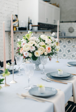 Kitchen and beautiful table set in room. Beautiful table setting for Easter