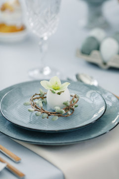 Kitchen and beautiful table set in room. Beautiful table setting for Easter