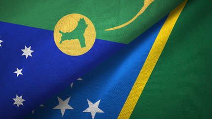 Christmas Island and Solomon Islands two flags textile cloth, fabric texture
