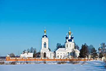 Winter landscape with the Holy Dormition Monastery (nunnery) founded in the 17th century/ village Dunilovo/ Ivanovo region/ Russia. Golden Ring of Russia Travel