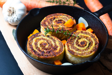 Food concept Fleischschnackas  Alsatian, Alsace French local food meat stuffed in egg roll pasta in skillet iron pan