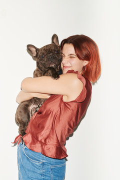 Portrait of black bulldog and its owner