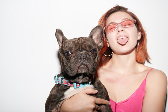 Portrait of black bulldog and its owner