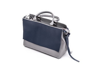 Luxury fashion women leather blue handbag isolated on a white background.