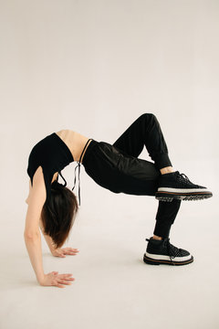 Unrecognizable dancer in wheel pose