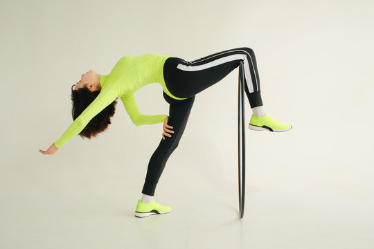 Flexible athlete exercising with hoop