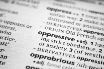 Fototapeta premium Word or phrase Oppressive in a dictionary.