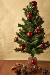 christmas tree and decorations on wooden background