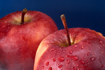Two red apples after being washed