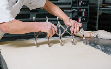 Baker making pastries