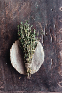 Bunch of thyme on a rustic wooden desk