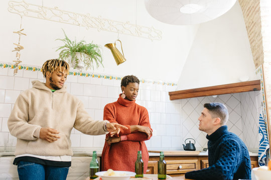 Friends chatting in kitchen