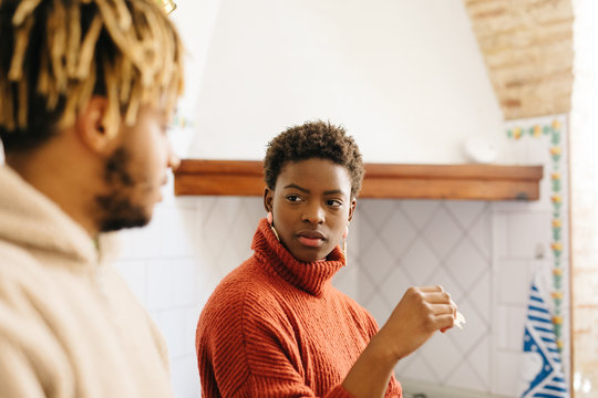 Friends chatting in kitchen