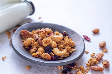 homemade granola with bottle of milk .