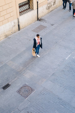 Black woman walking from shop