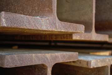 Detail of stacked steel I-beams.