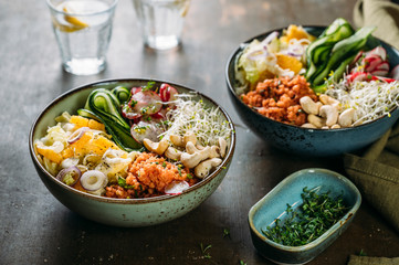 Food: Healthy salad bowl with vegetables, cereals and nuts