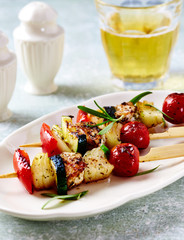 Shish Kebabs on bright wooden background. 