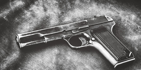 Old pistol gun on old cloth