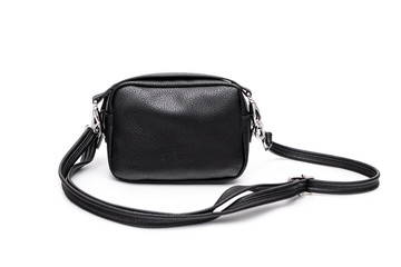 Luxury fashion women leather black handbag isolated on a white background.