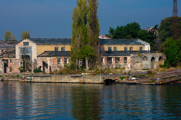 Fototapeta na wymiar Old and abandoned building on Golden Horn waterway (Altın Boynuz or Halic). Istanbul, Turkey