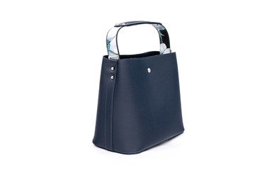 Luxury fashion women leather blue handbag isolated on a white background.