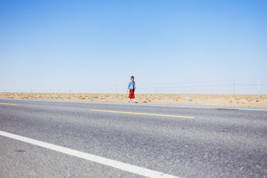 Girl on the desert road, Xinjiang