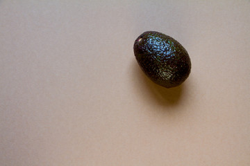 Row avocado on brown background, creative food concept