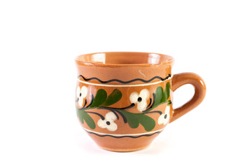 Ceramic cup in ethnic style on white background