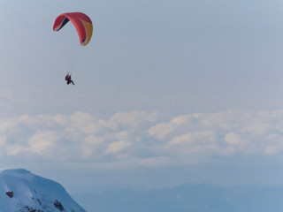 Fototapeta na wymiar Mountain winter, paraglider