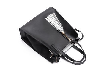 Luxury fashion women leather black handbag isolated on a white background.