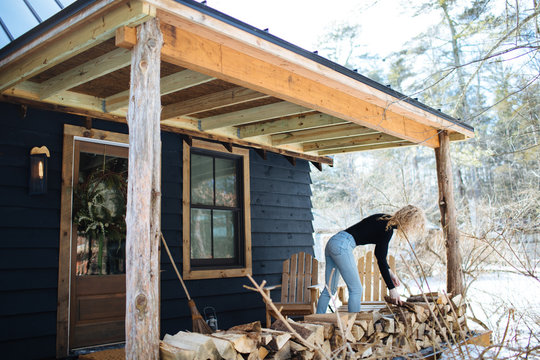 woman stacking firewood