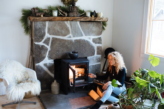 woman builds fire