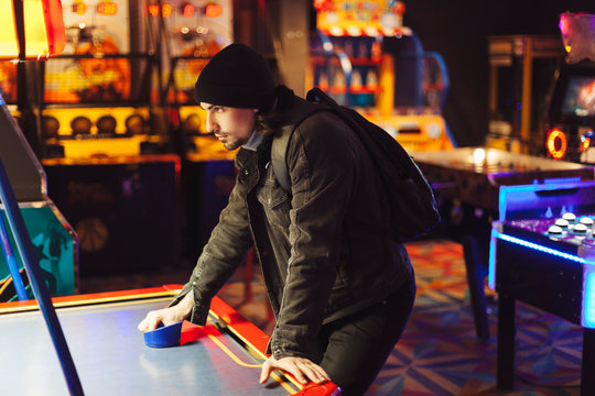 Man in retro game room