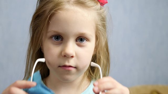 Portrait of Cute Little Girl Wears Glasses Having Bad Vision. Ophthalmologist concept