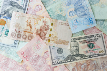 Fototapeta na wymiar Close up Thai money note and dollars using as background stacking, Business concept