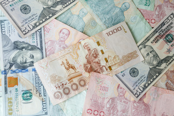 Close up Thai money note and dollars using as background stacking, Business concept