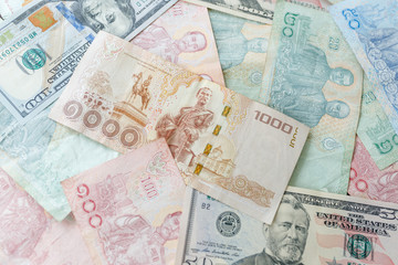 Fototapeta na wymiar Close up Thai money note and dollars using as background stacking, Business concept