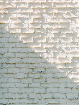 Shadow falling on brick wall