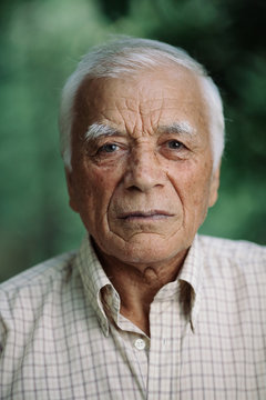Elderly gray-haired man in shirt