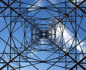 High voltage transmission tower (electricity pylon) on blue sky