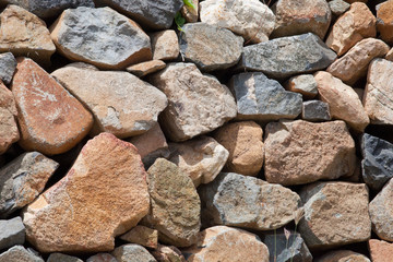 Rough weathered sandstone wall surface texture close up