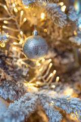beautiful blue and silver christmas decorations on christmas tree on garland background