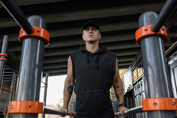 Sportsman training on parallel bars