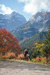 Two happy Sisters Hugging in the Autumn Alps