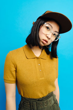 Young charming stylish lady in cap