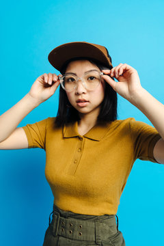 Young charming stylish lady in cap