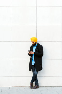 Young handsome Indian Sikh in the street